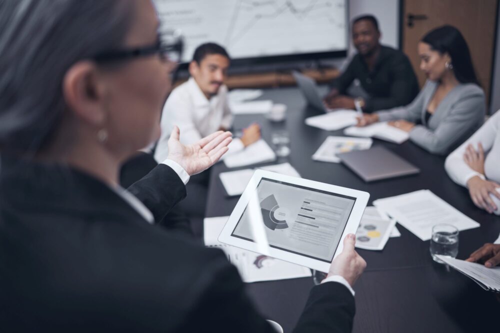 Woman presenting at a meeting.