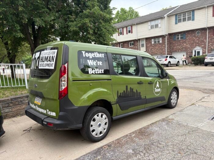 Image of a green alternative response van with the words 